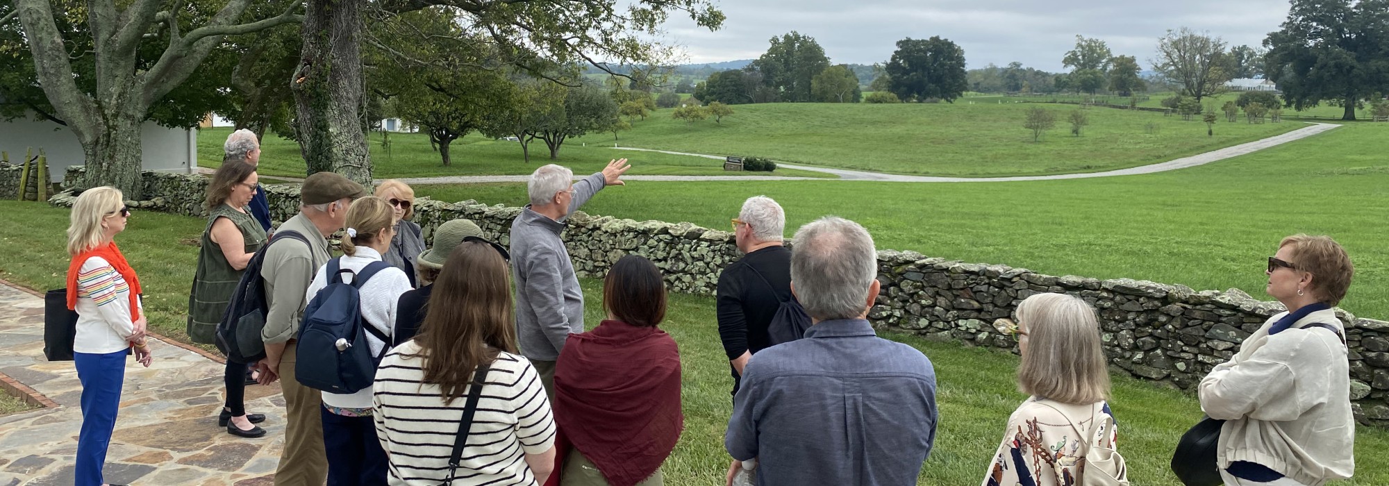 Group of people looking at field. 