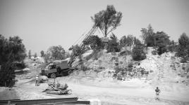 Crane lifting trees into place, Disneyland, CA
