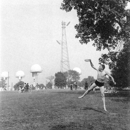"A frisbee player enjoys the Point despite the radar towers which the U.S. Army maintained there from 1953 to 1971"
